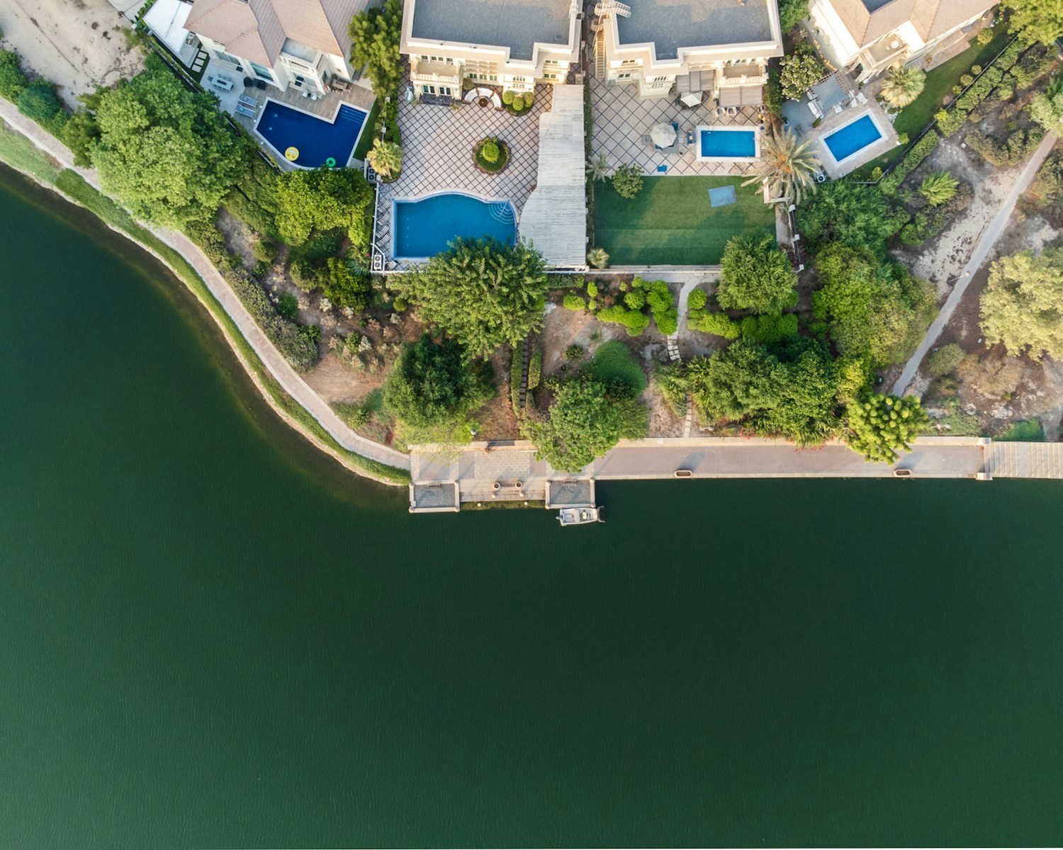 top villa movers and packers in JVT: an aerial view of a house with a swimming pool